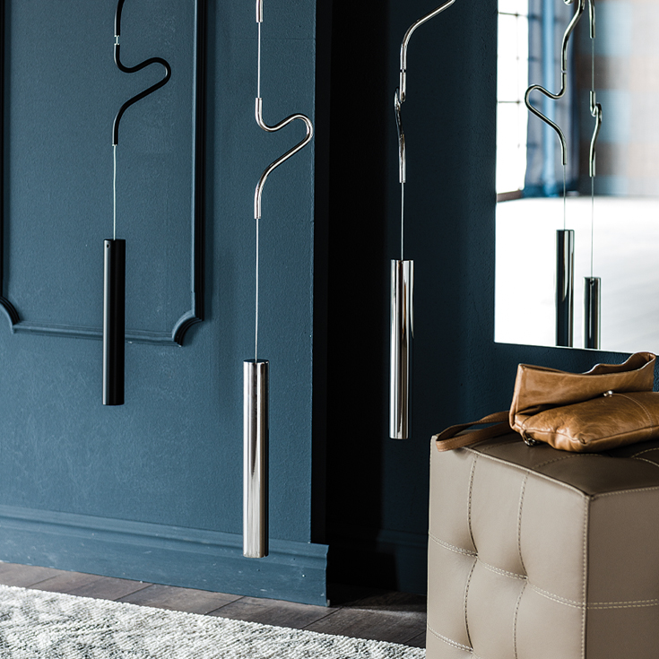A unique ceiling-mounted coat hanger with rotating elements and a sculptural design, ideal...